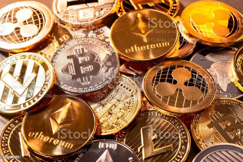 Frankfurt, Hesse, Germany - April 17, 2018: Many coins of various cryptocurrencies